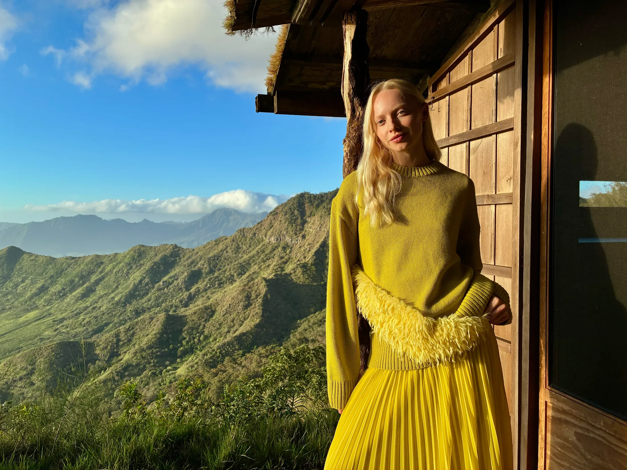 Image showing woman yellow sweater poses outdoors